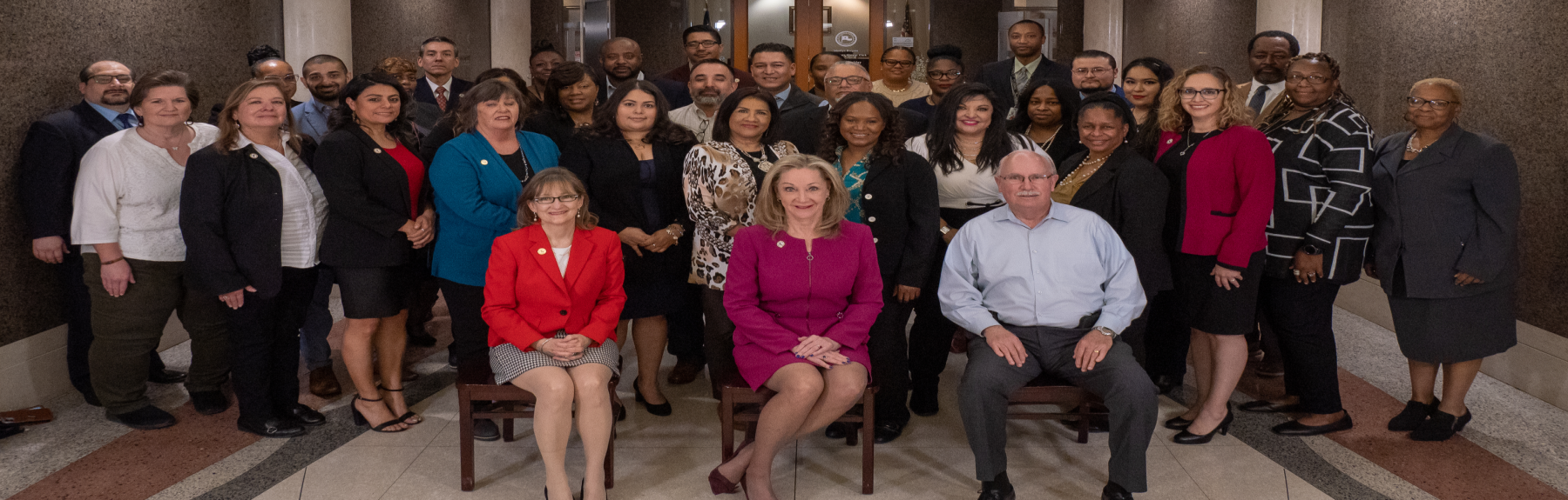 group photo depicting the DCO’s management team, led by District Clerk Marilyn Burgess and Chief Deputies Wes McCoy and Judith Snively.