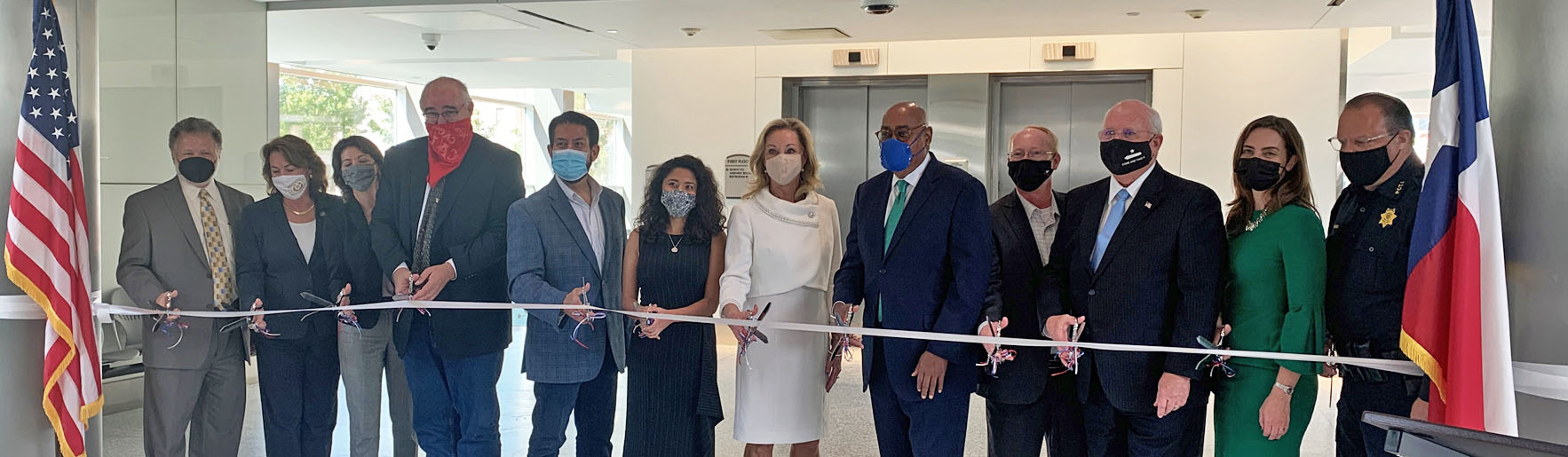 	image showing that, In February of 2022, jury service resumed at the renovated Jury Assembly Plaza located in downtown Houston. District Clerk Marilyn Burgess held a ribbon cutting ceremony. All the members of the Harris County Commissioners Court attended the ceremony, along with members of the judiciary and law enforcement.